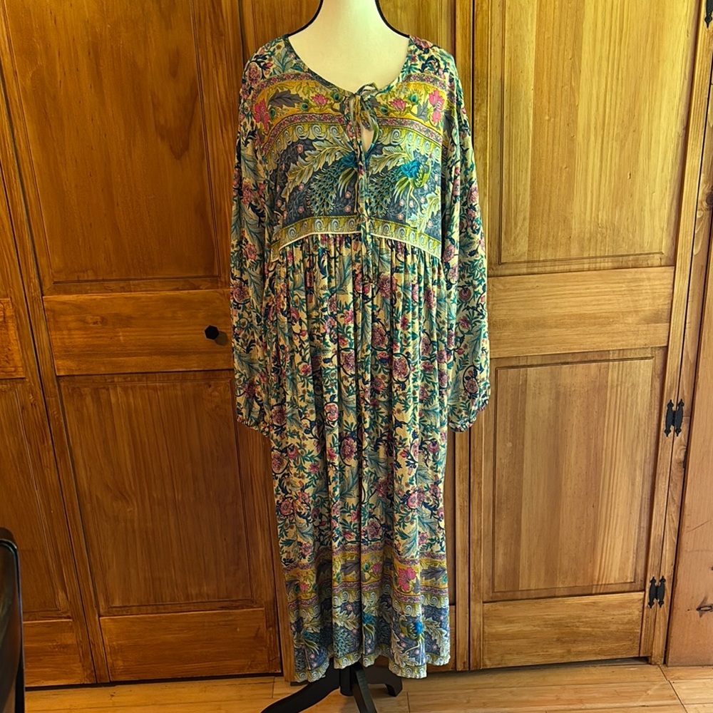 Floral flowy dress with bib top in a unusually soft and vibrant print